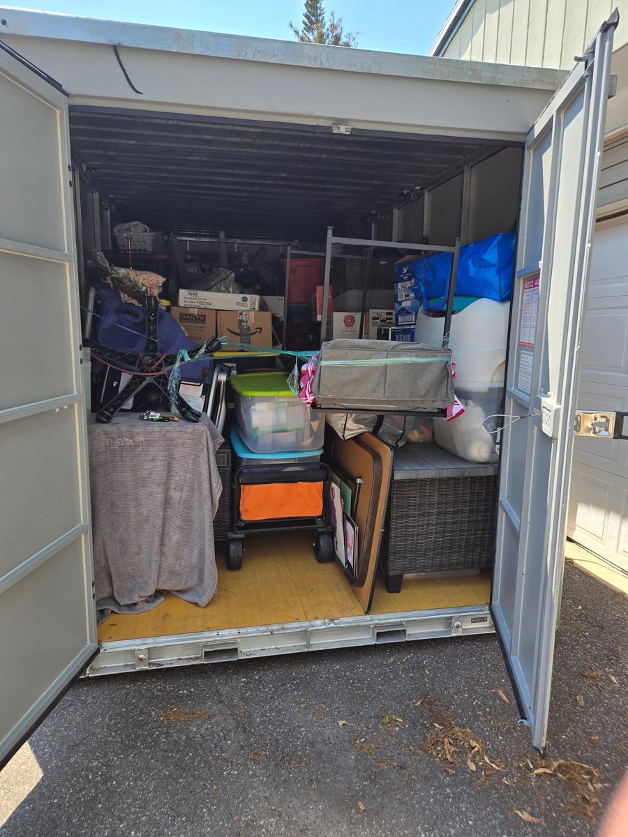 Before junk removal: storage unit packed full of junk